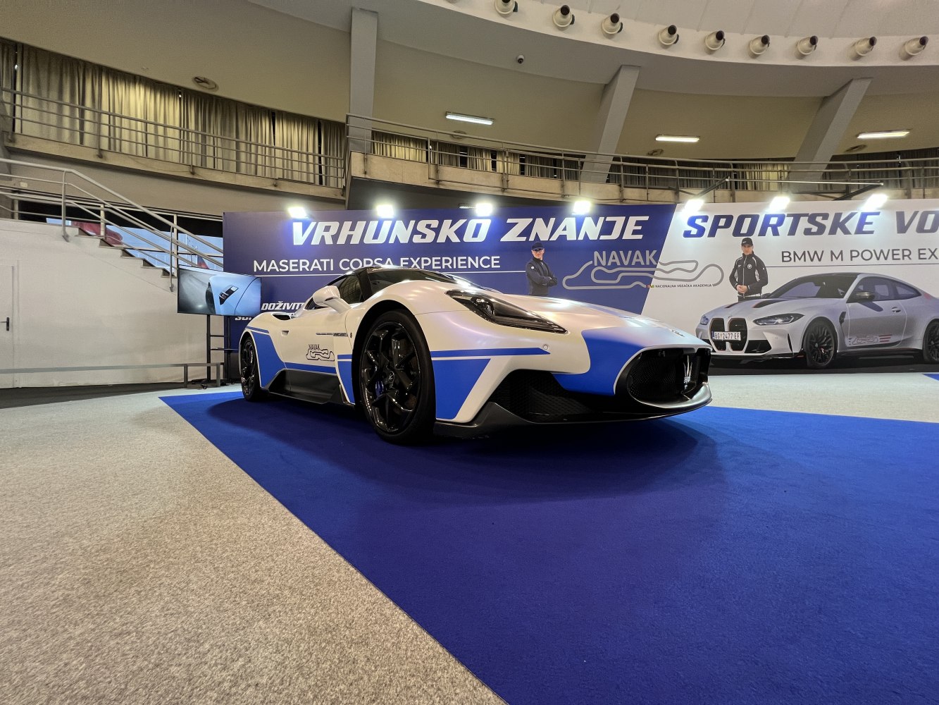 Front and side view of a sports car with aerodynamic styling and racing markings