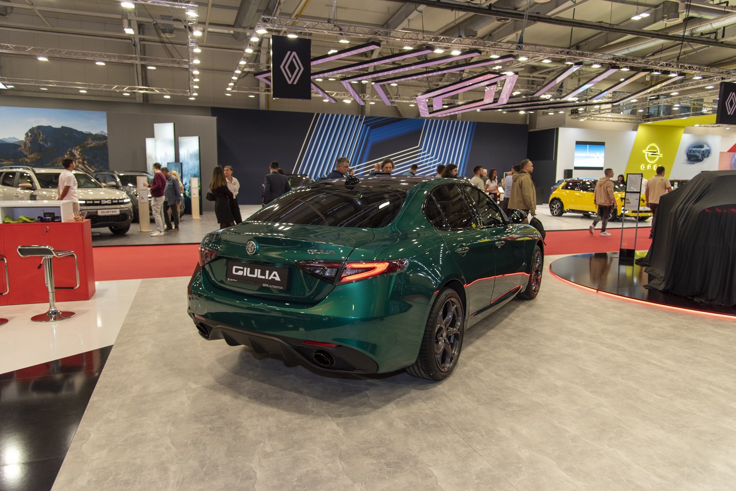Rear view of a sporty sedan with dual exhaust and sleek LED tail lights
