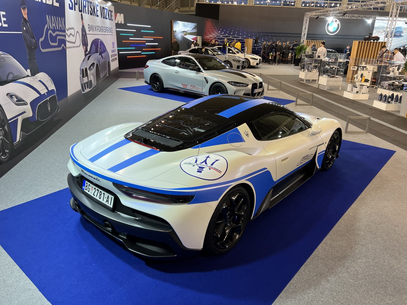 Rear and side view with blue racing stripes and aerodynamic details