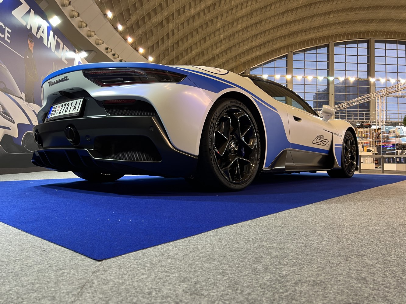 Rear view with diffuser and black multi-spoke wheels