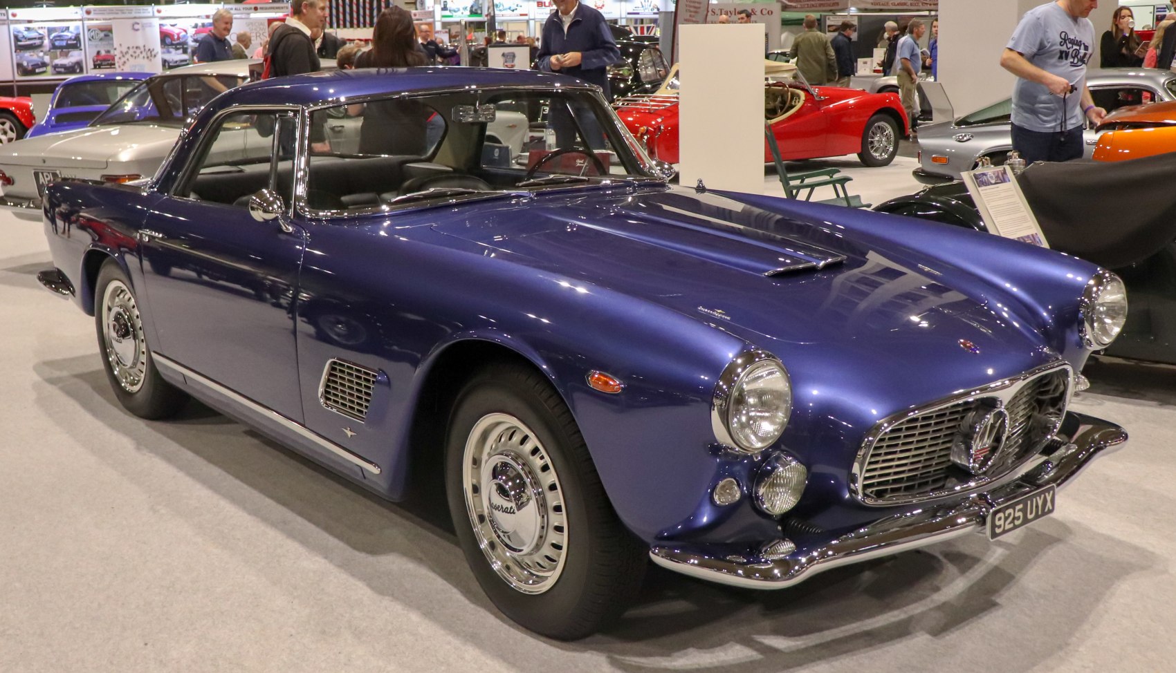 Vintage coupe with oval front grille and round headlights