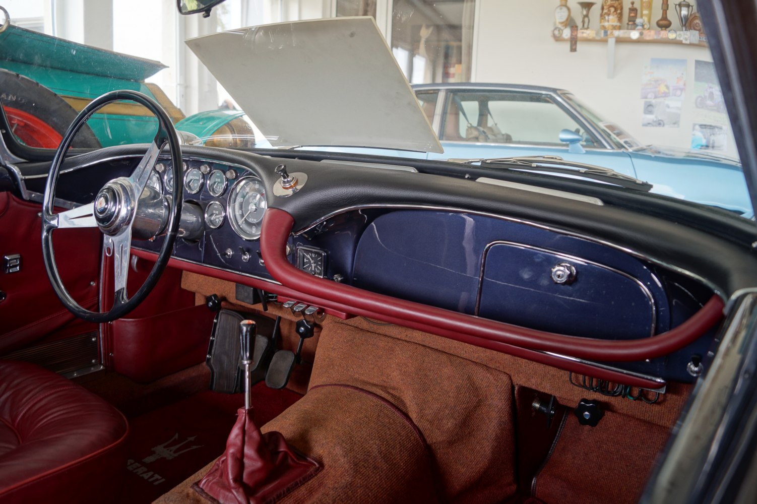 Vintage car interior with retro dashboard and classic steering wheel