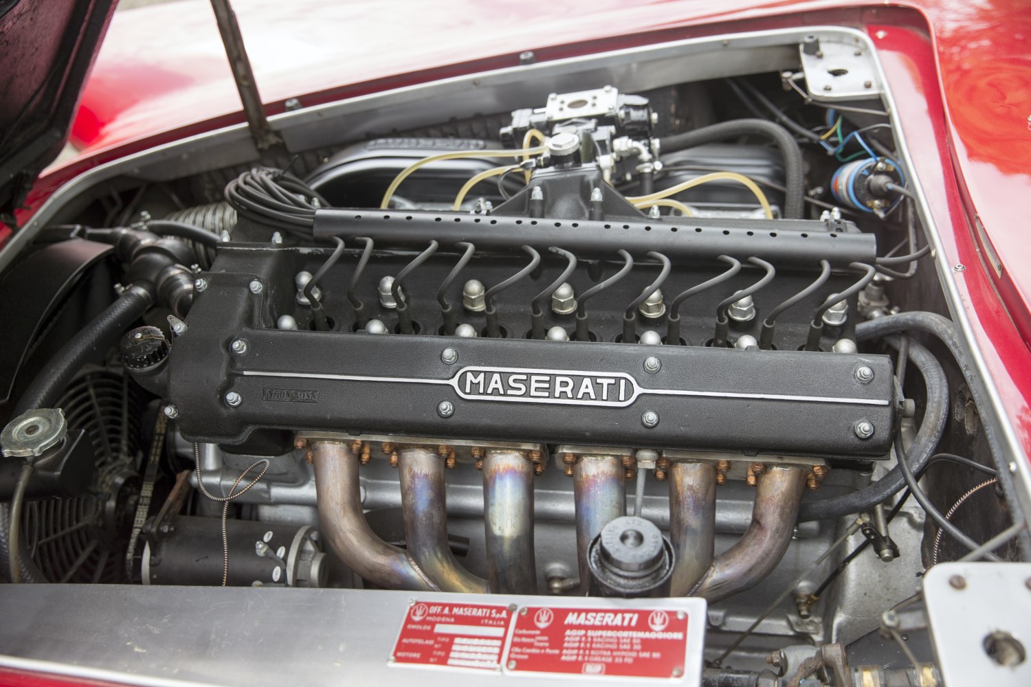 Close-up of classic vintage inline engine with Maserati branding