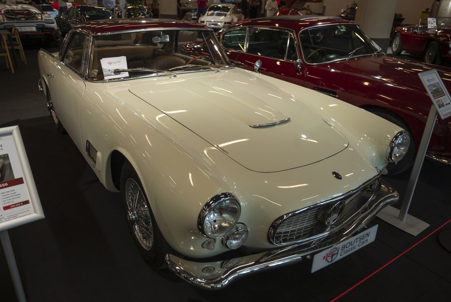 Front view with round headlights, chrome grille, and chrome bumpers