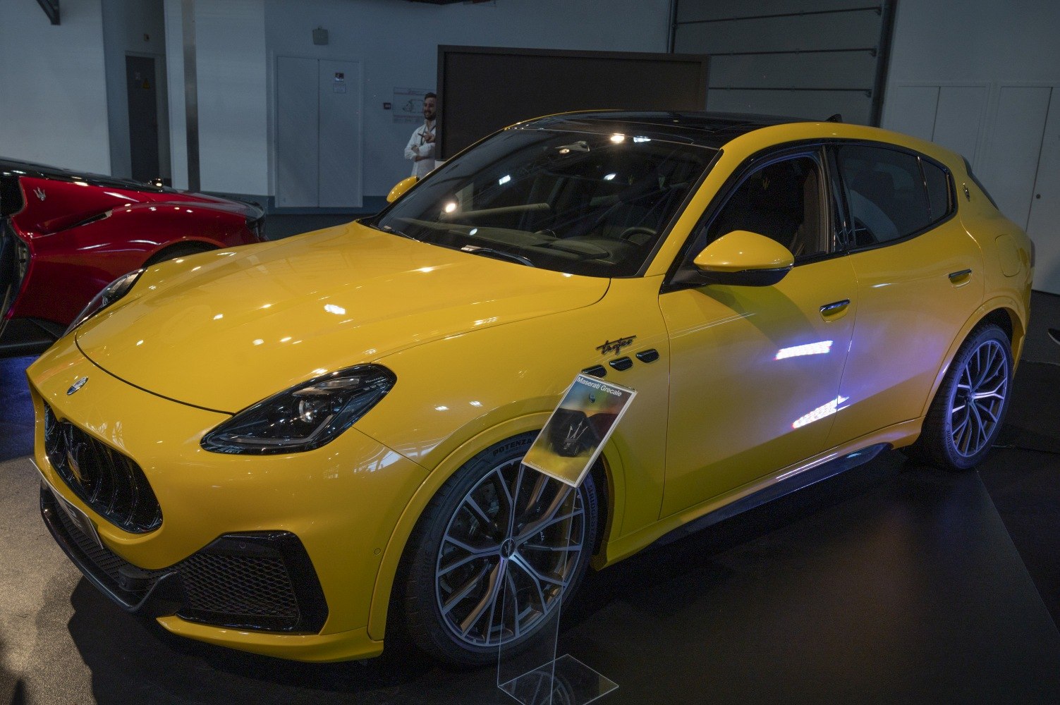 Yellow Maserati SUV with sporty design, sleek headlights, and detailed alloy wheels