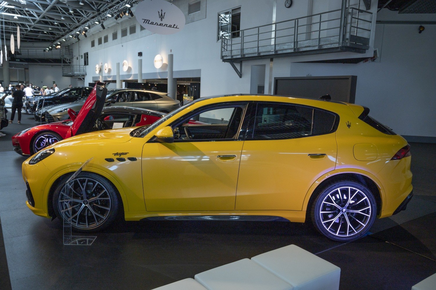 Yellow luxury SUV with sleek side profile and alloy wheels