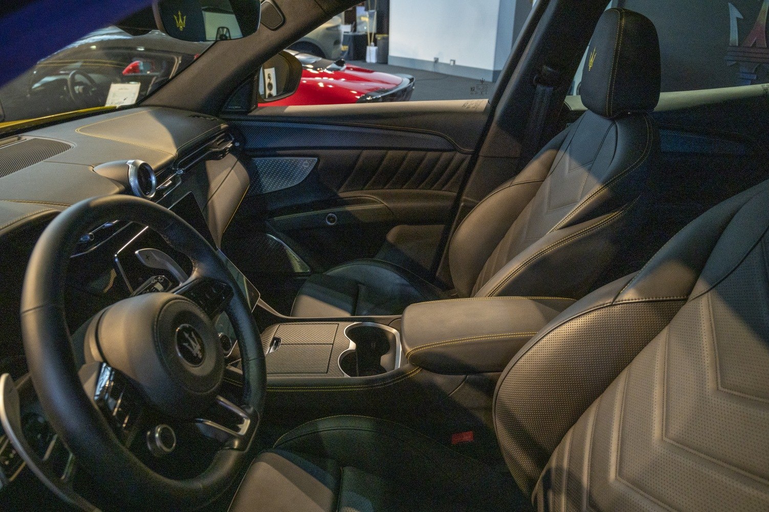 Premium leather seats with detailed stitching and elegant dashboard design.