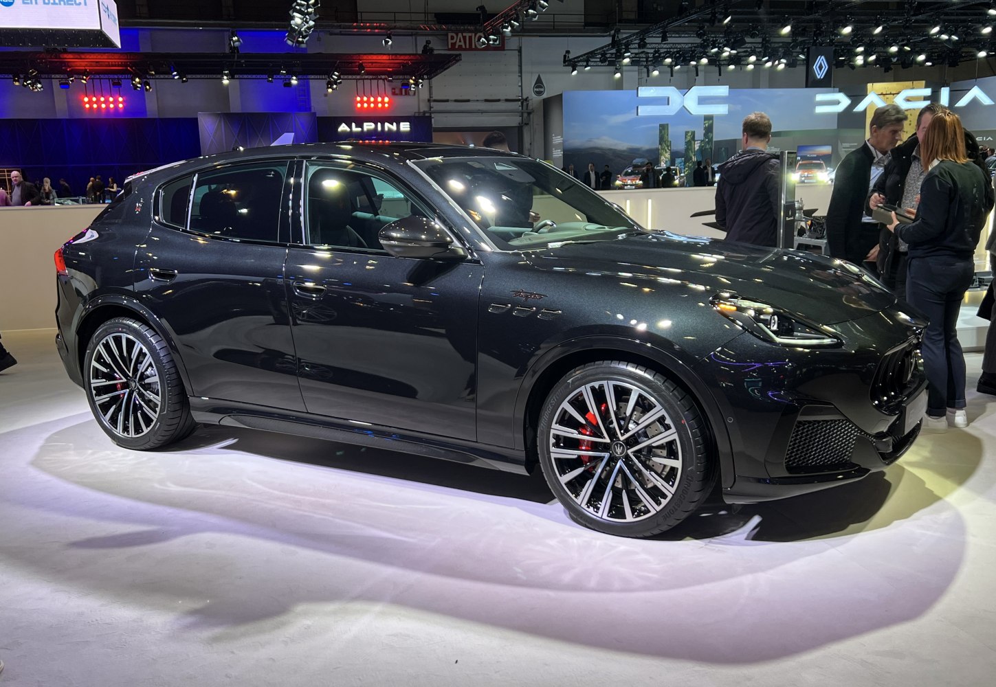 Sleek side profile and multi-spoke alloy wheels with red brake calipers
