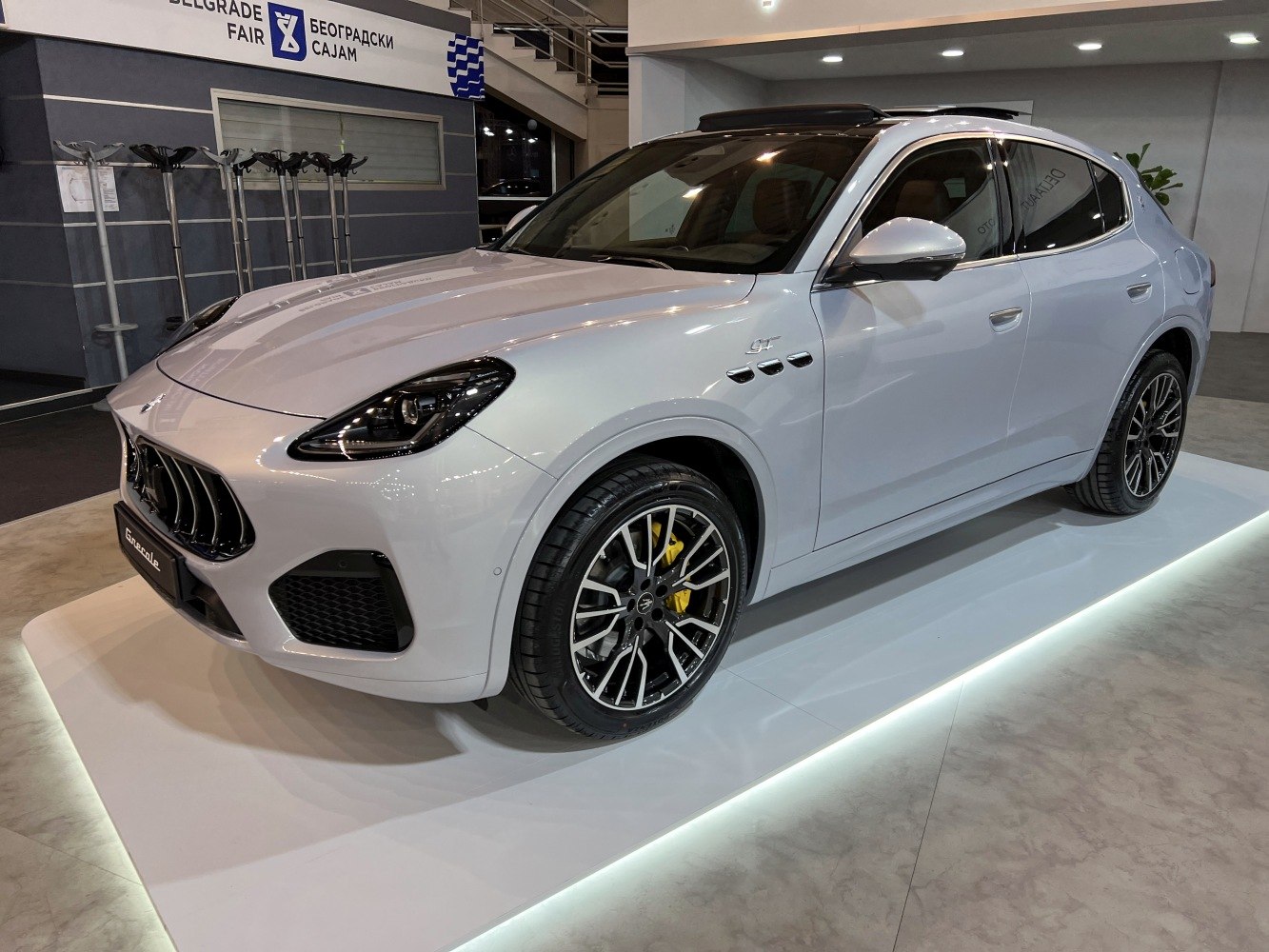 Sleek front side profile with sporty alloy wheels and yellow brake calipers