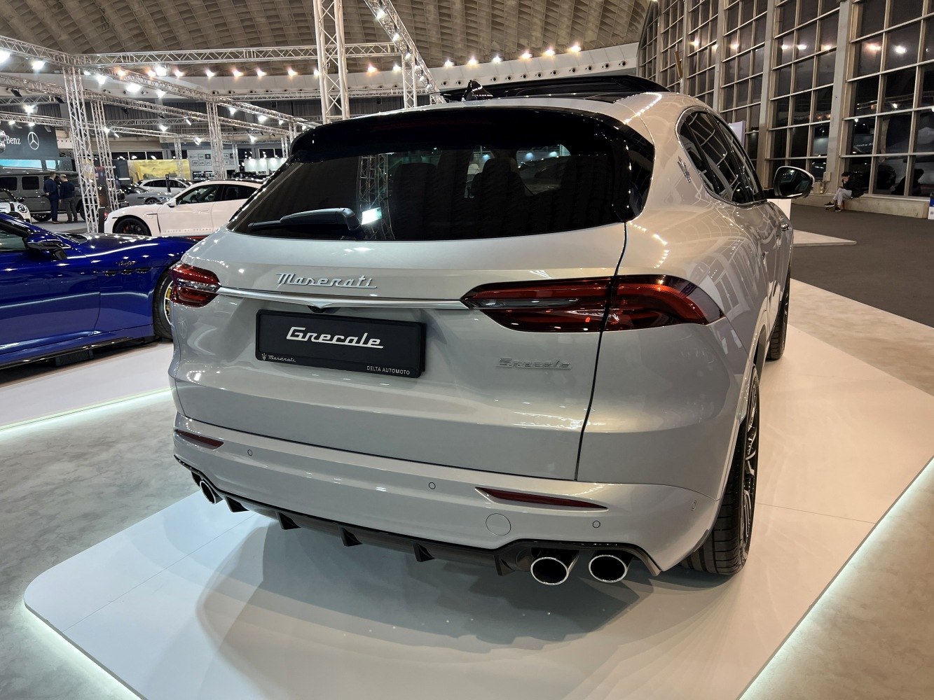 Rear view of SUV with quad exhaust tips and sleek taillights