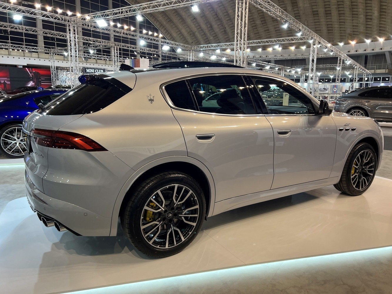 Side and rear view of luxury SUV with sporty wheels and tinted windows