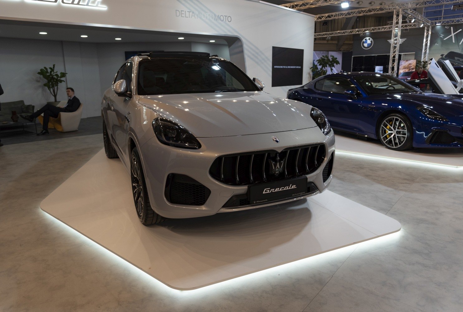 Front close-up of a luxury SUV with bold grille and sleek headlights