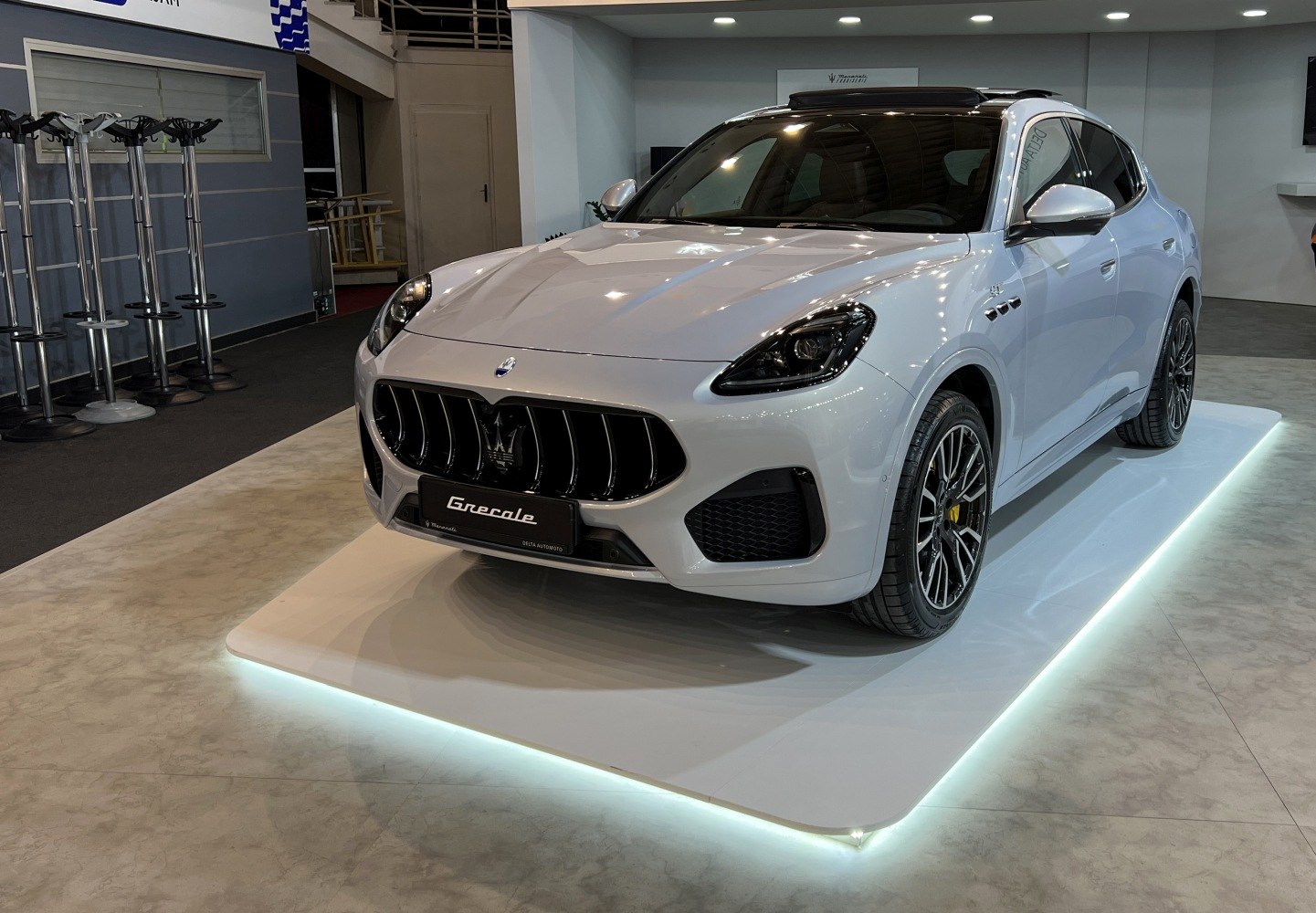 White SUV with bold grille, LED headlights, alloy wheels