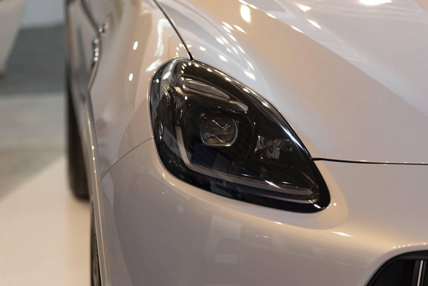Close-up of a modern car headlight with sleek design