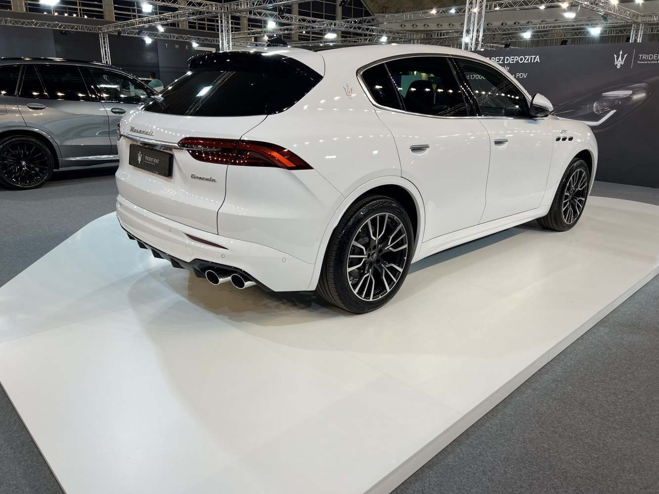 SUV rear and side view with quad exhaust and alloy wheels
