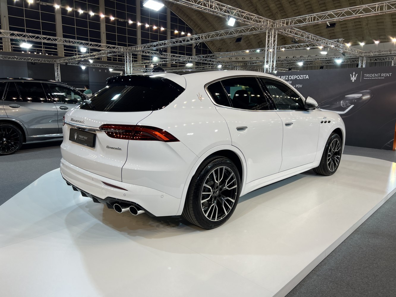 Rear and side view with sleek taillights and quad exhausts