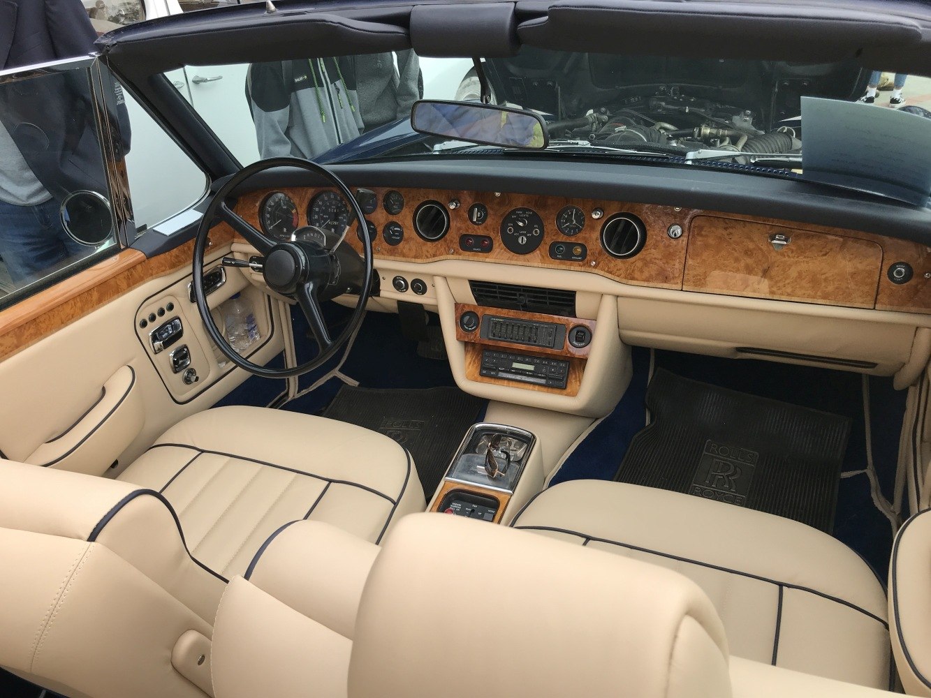 Luxury wood dashboard and cream leather seats interior