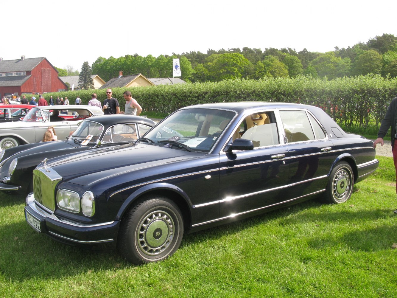 Classic luxury sedan with iconic front grille, round headlights, and chrome detailing
