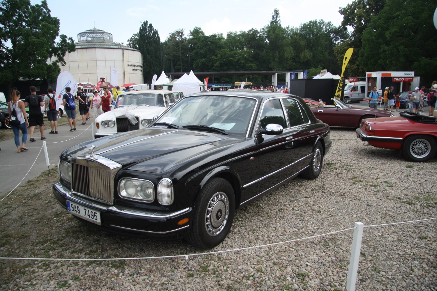 Luxury sedan with chrome grille and round headlights