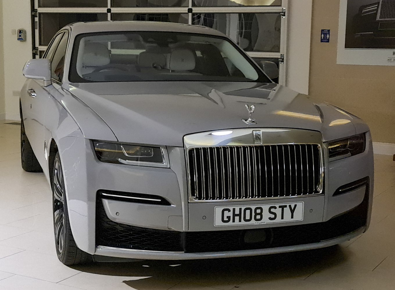Luxury sedan front with iconic grille and Spirit of Ecstasy hood ornament