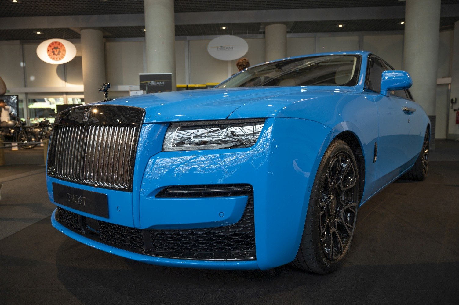 Close-up of modern car front with vertical grille and LED headlights