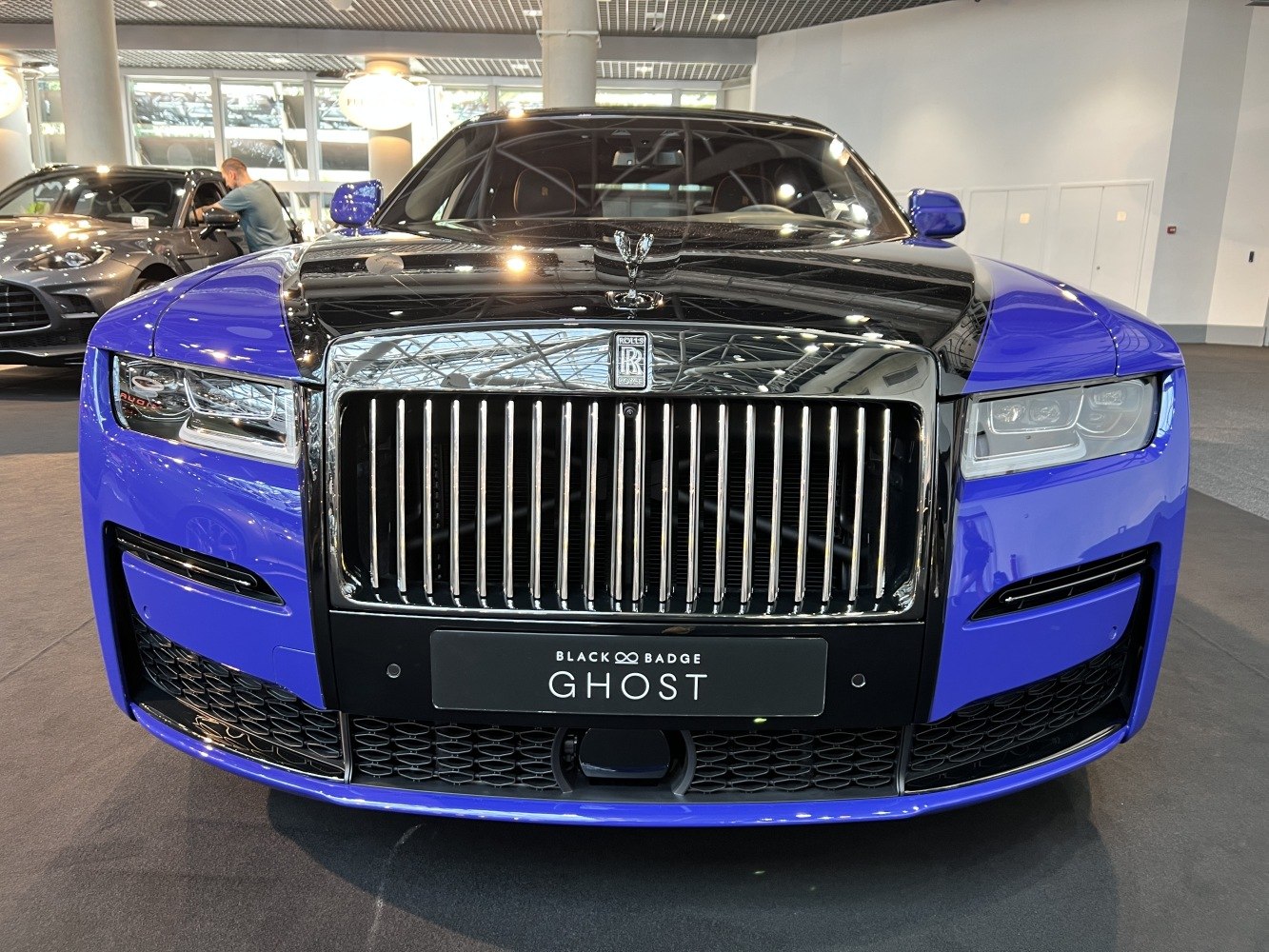 Front grille and LED headlights of luxury sedan, striking design.