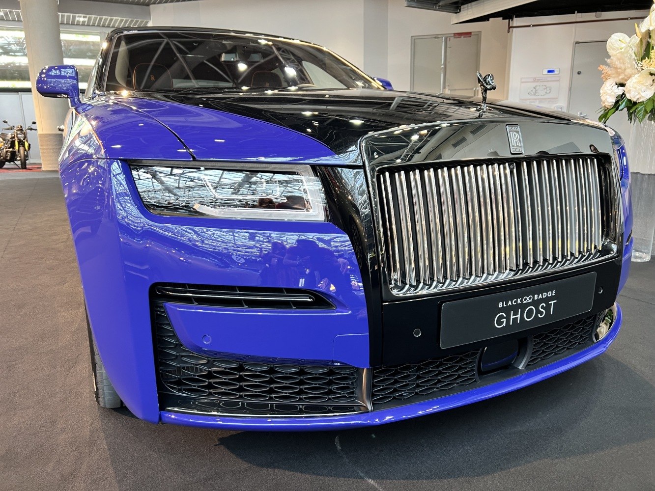 Close-up of front grille and advanced headlight unit on luxury vehicle