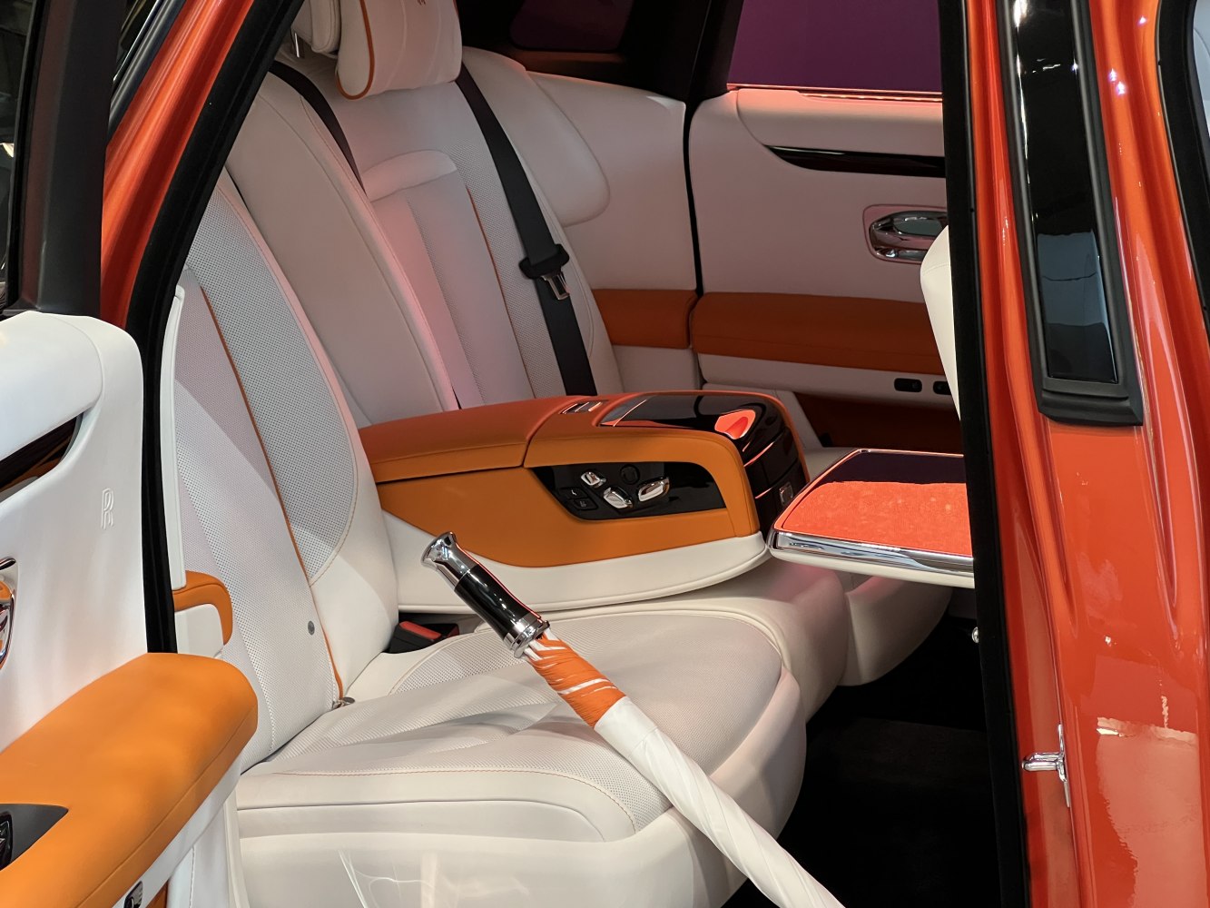 Luxury car rear seats with leather trim and built-in umbrella