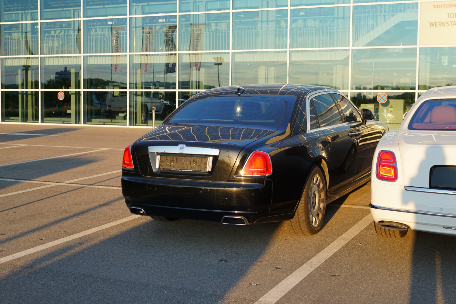 Rear view of luxury sedan with signature taillights and extended wheelbase design