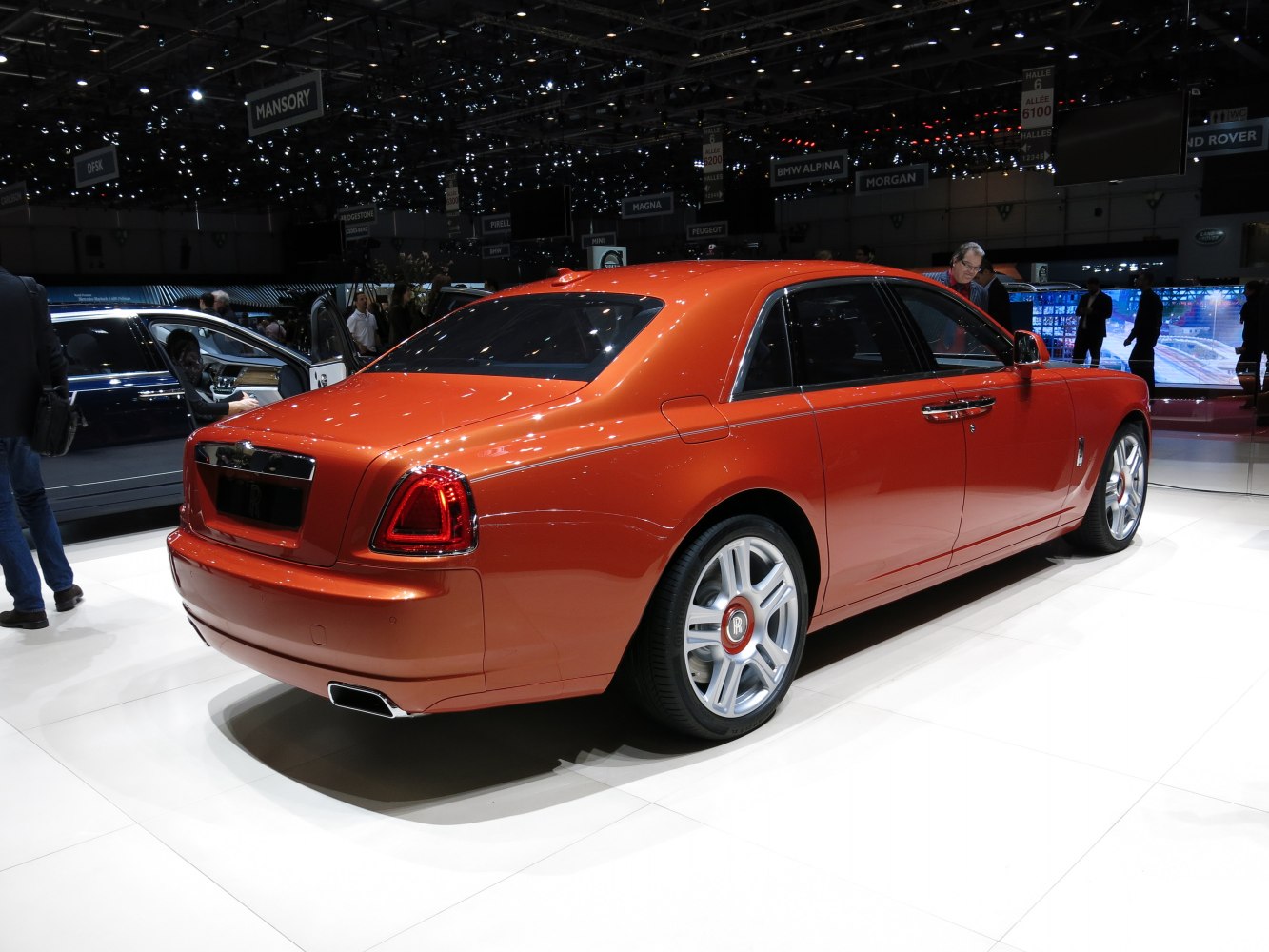Rear-side view of luxury sedan with distinctive taillights and silver wheels