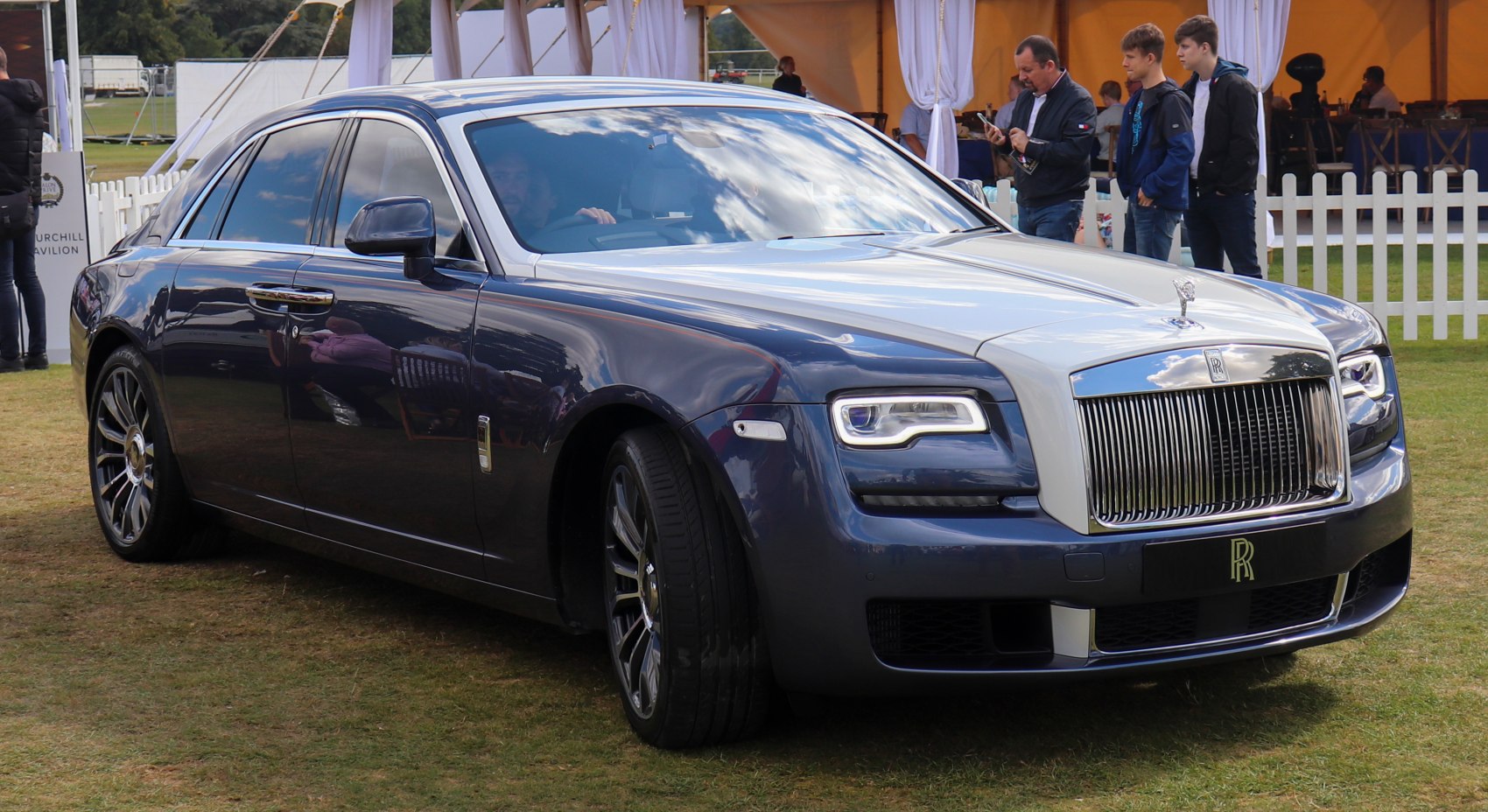 Front and side view of luxury sedan with LED headlights and iconic grille