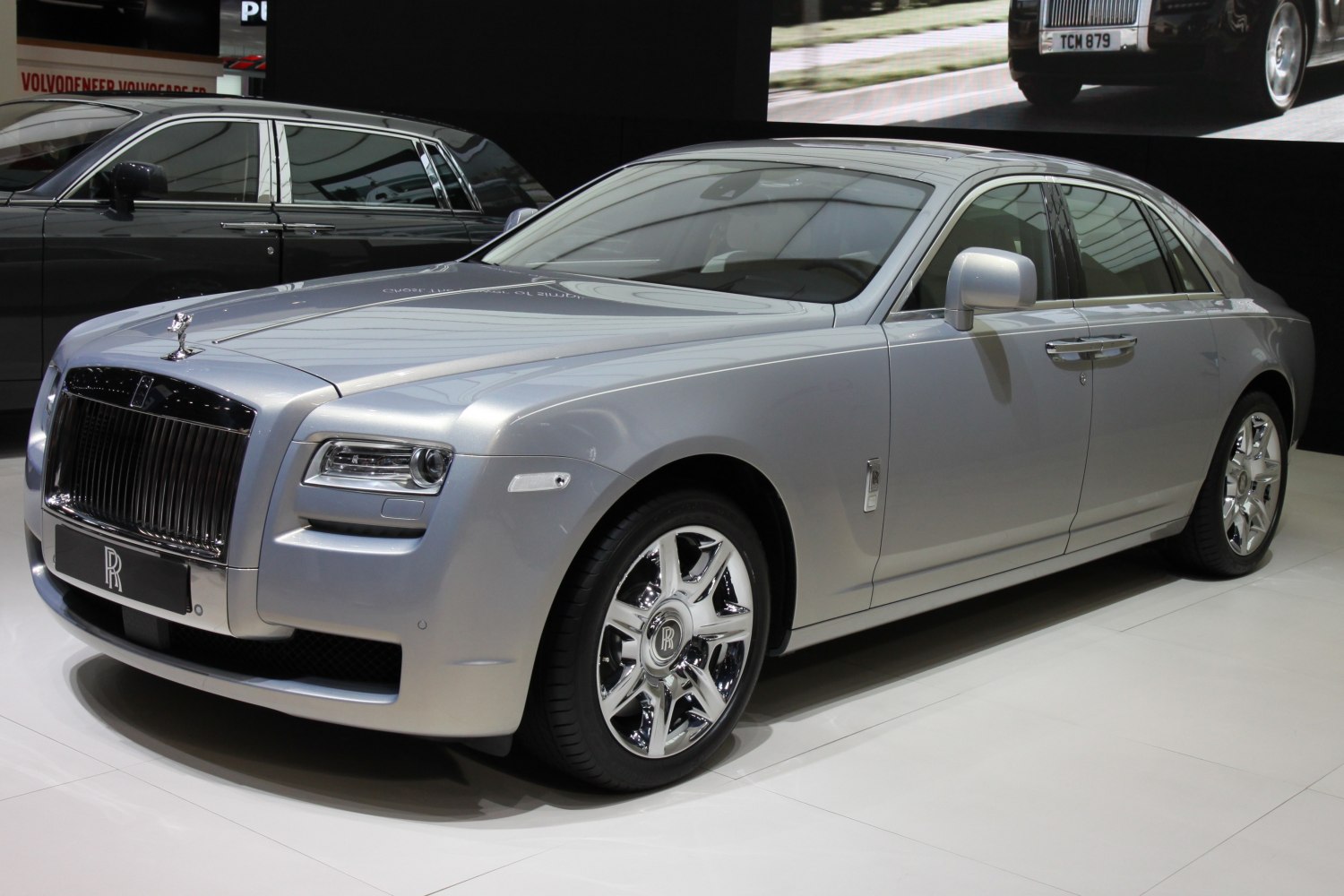 Silver luxury sedan with distinct front grille and chrome wheels