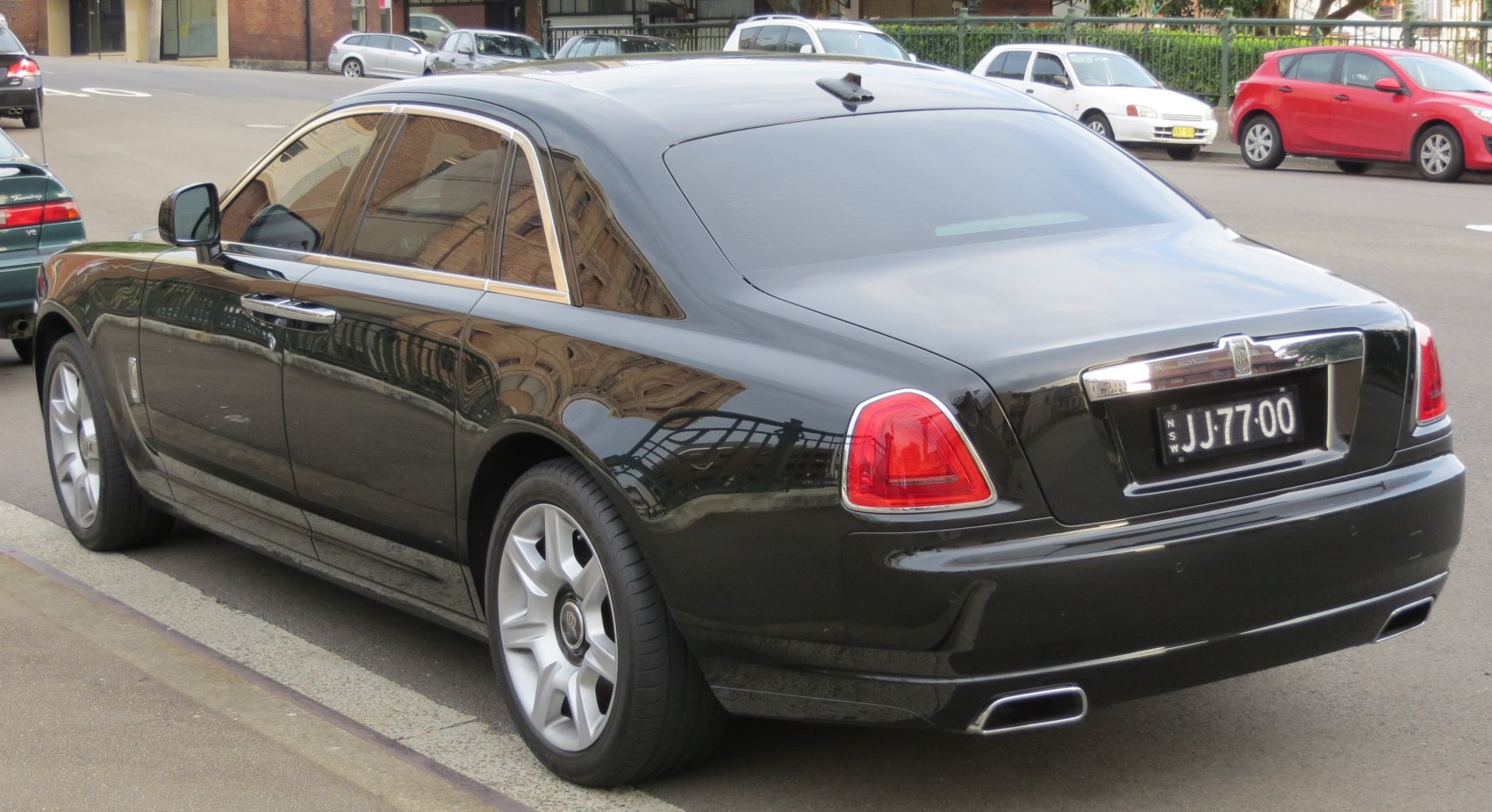 Sleek rear design with tinted windows and prominent alloy wheels.