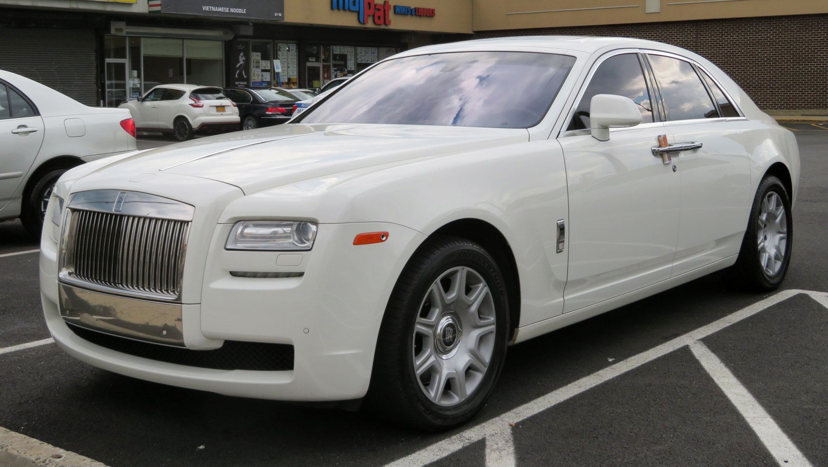 Luxury sedan with distinctive front grille and premium alloy wheels