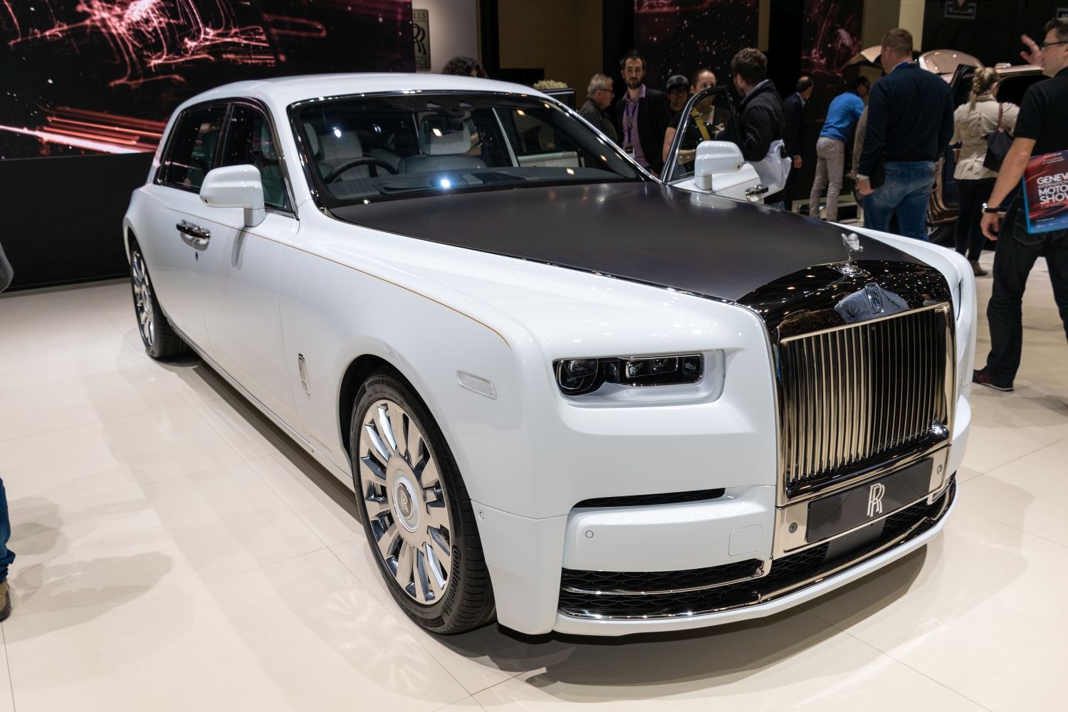 Extended wheelbase sedan with matte black hood and prominent chrome grille