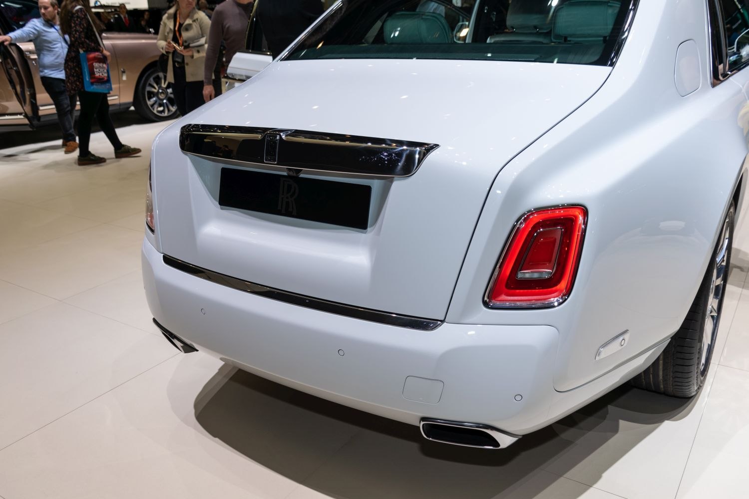 Rear view with distinctive tail light and chrome trim