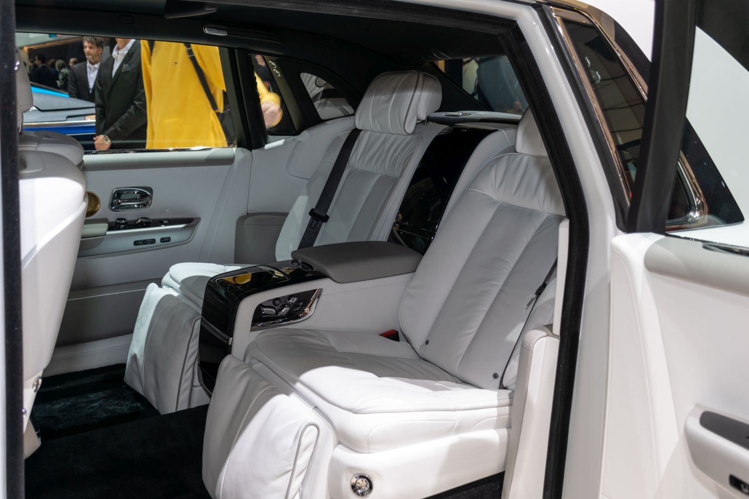 Luxury white leather rear seats with advanced controls and spacious design
