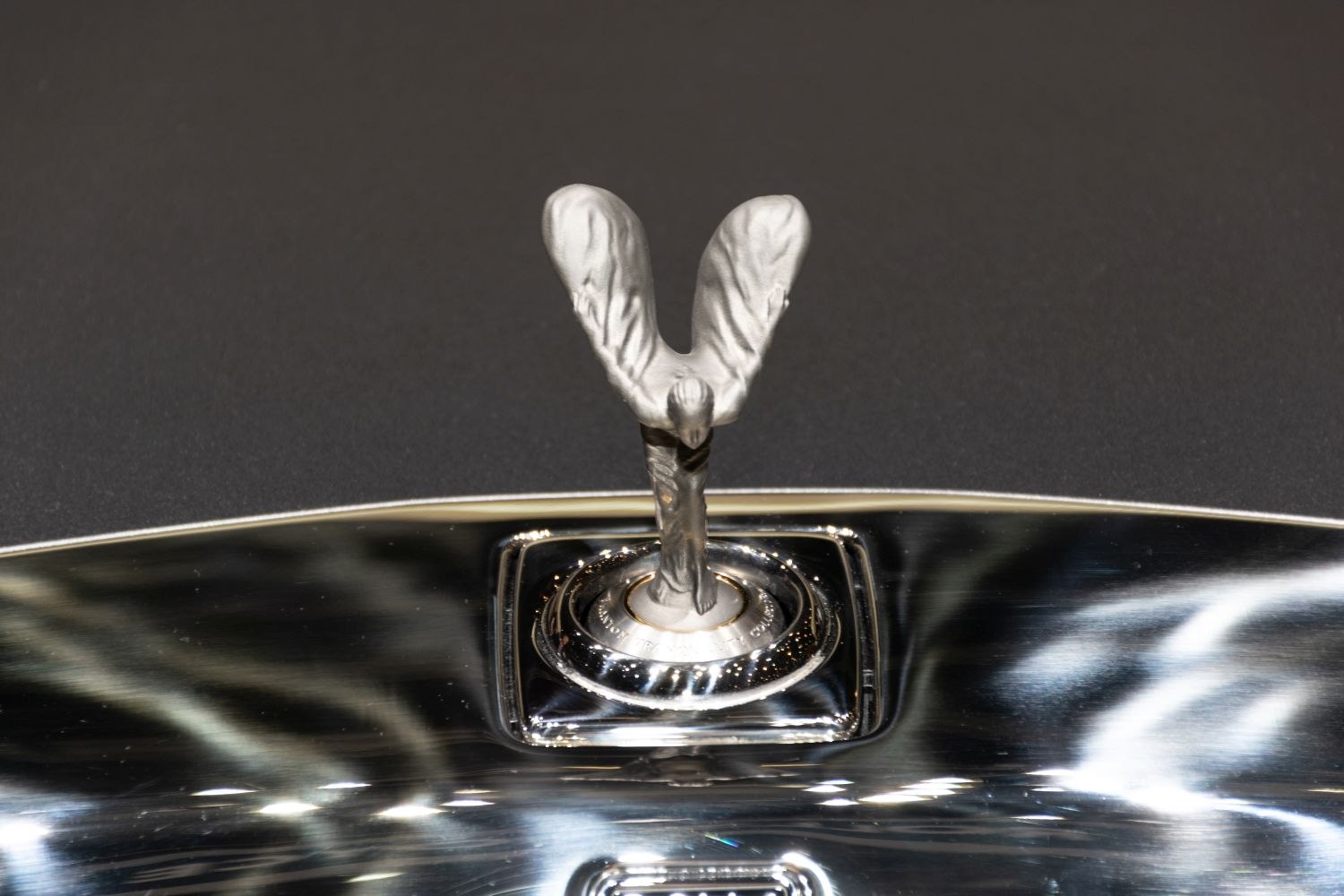 Spirit of Ecstasy hood ornament with polished silver base