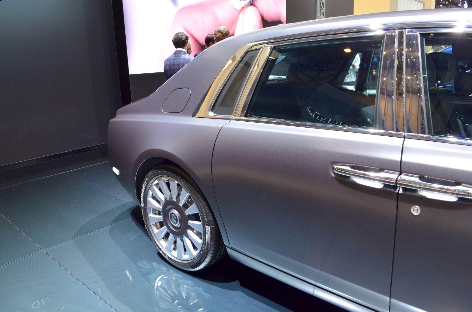 Rear side profile with luxury chrome accents and unique wheel design