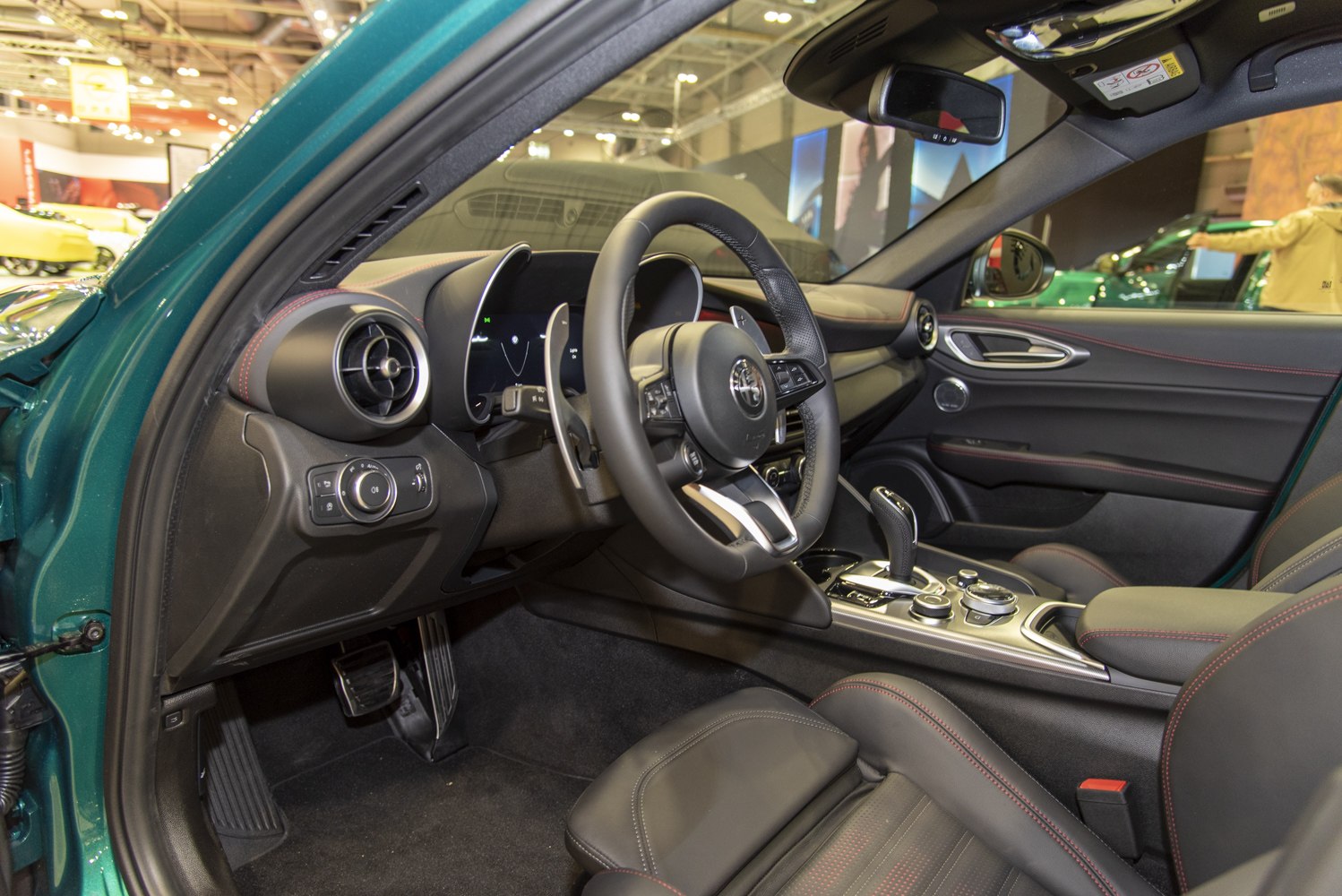 Modern steering wheel and digital dashboard with premium trim
