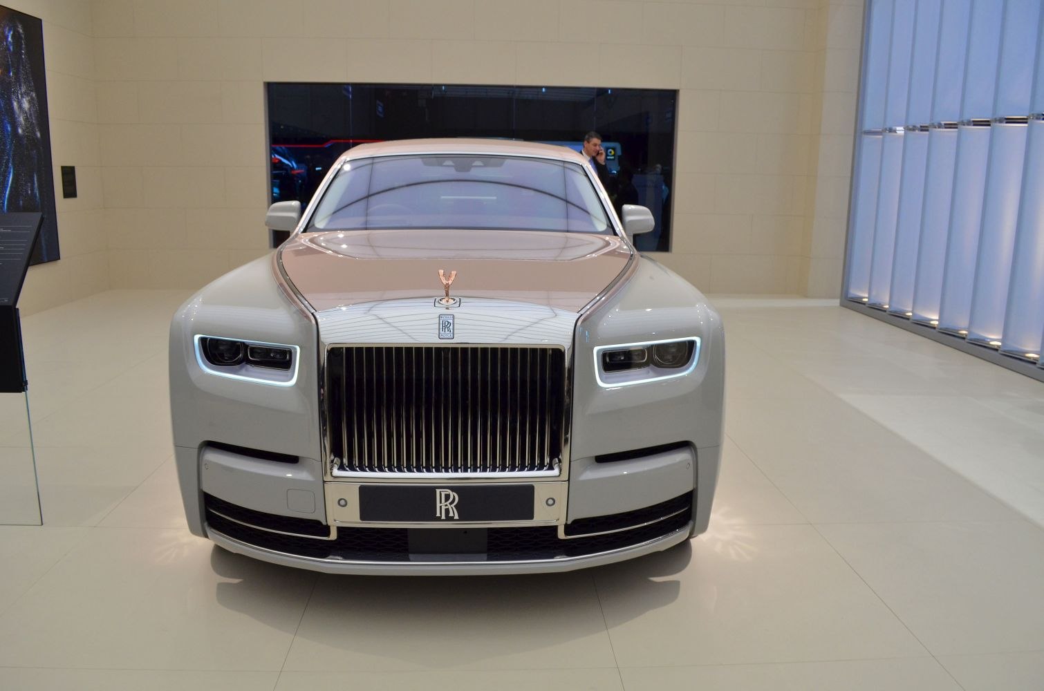 Front view luxury sedan with iconic grille and LED headlights