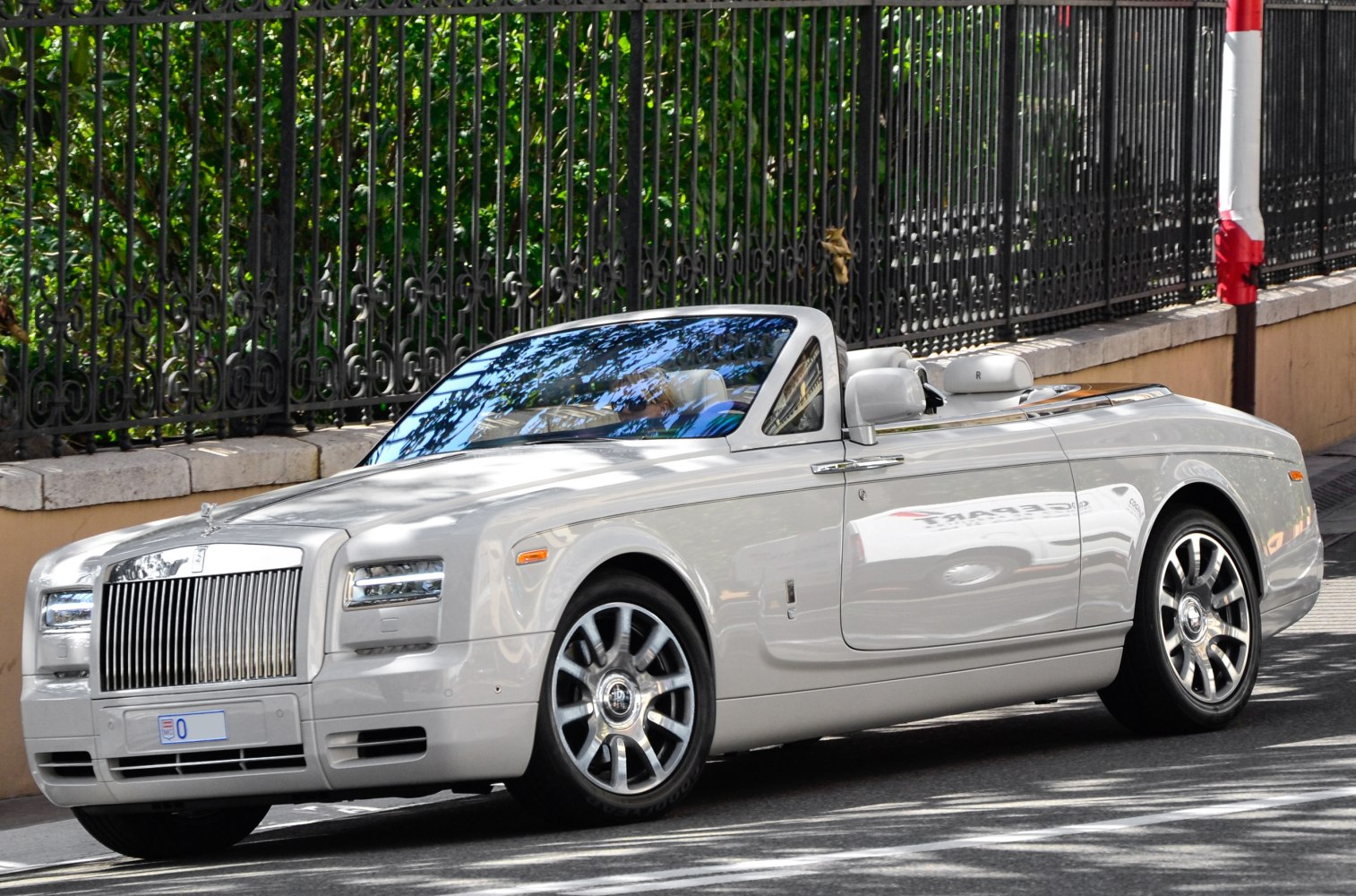 Luxury convertible with polished front grille and distinctive alloy wheels