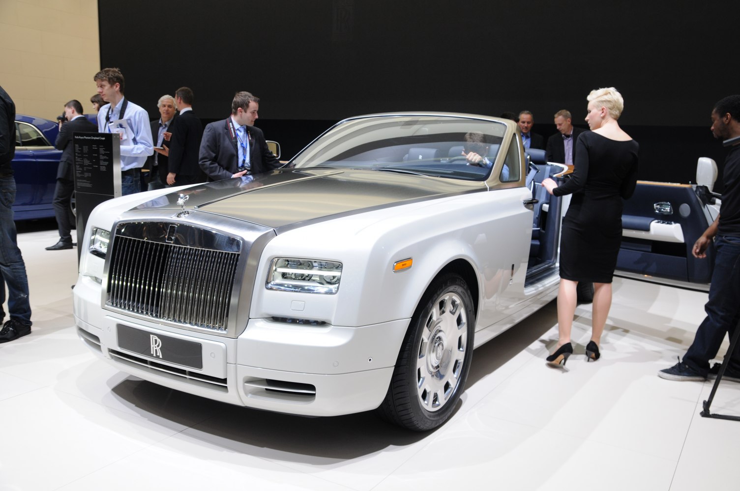 Luxury convertible with polished front grille and open doors