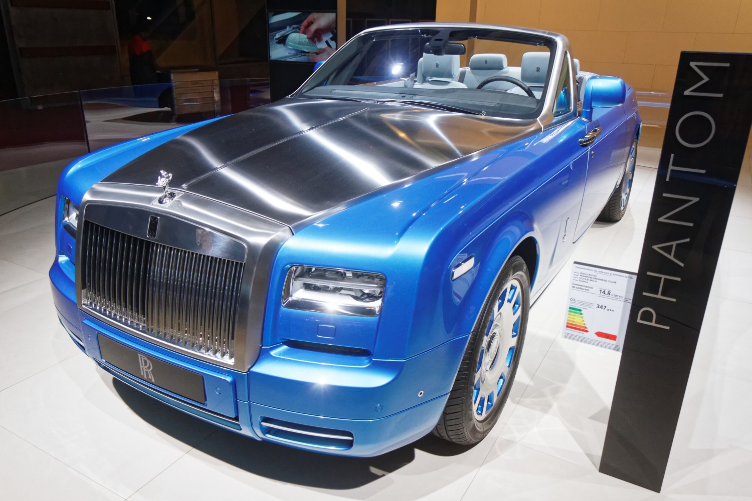 Polished large front grill and convertible luxury coupe