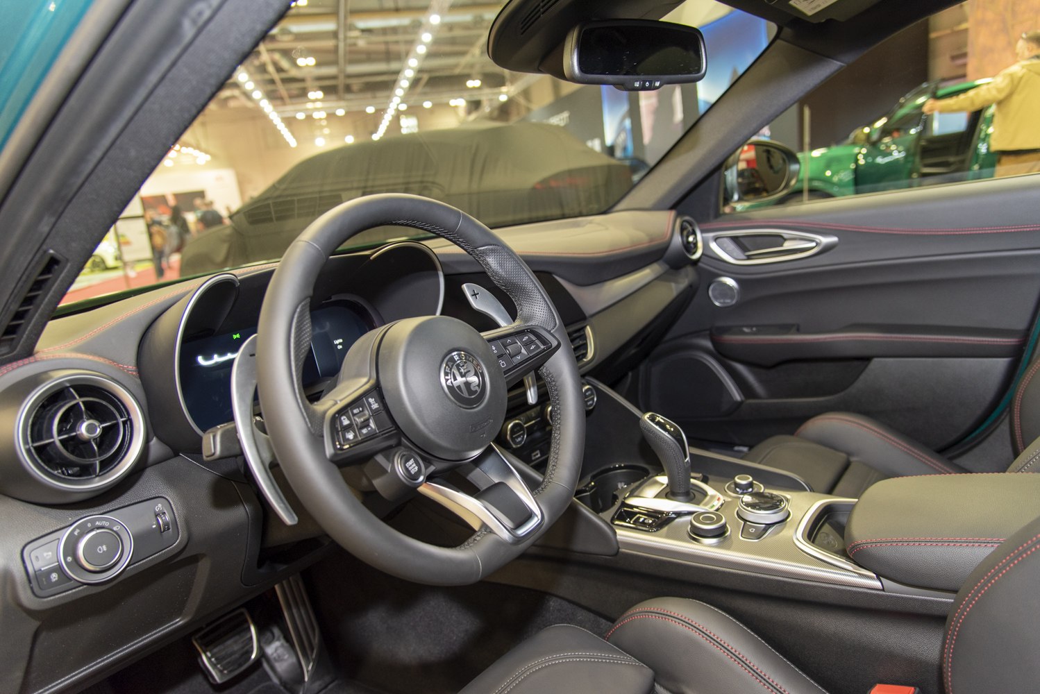 Steering wheel, digital dashboard, and center console interior features