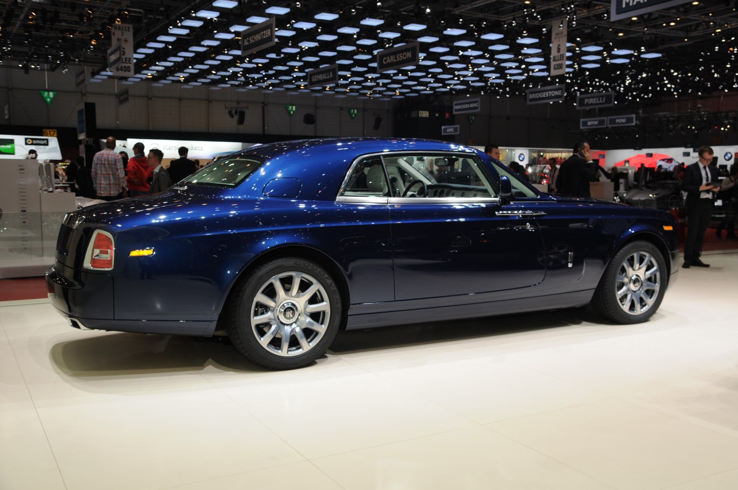 Luxury two-door grand tourer with sleek blue coupe design and polished wheels