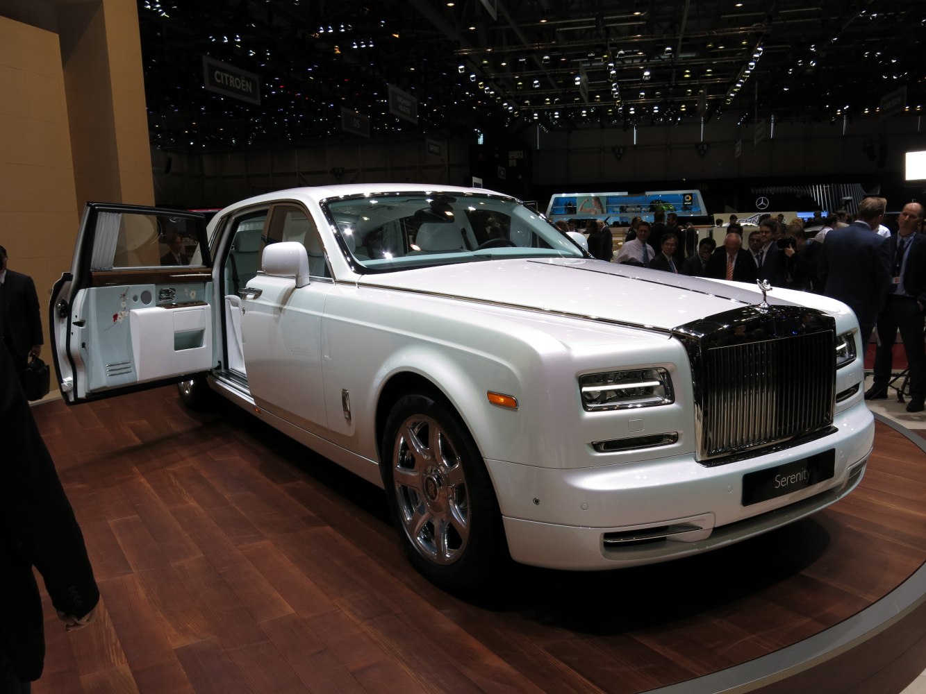 Extended wheelbase luxury limousine with rear-hinged rear doors and prominent chrome grille