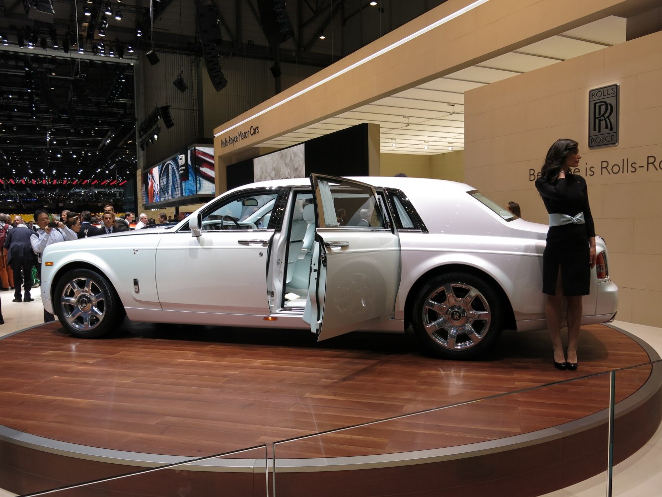 Extended wheelbase luxury sedan with rear suicide doors on display