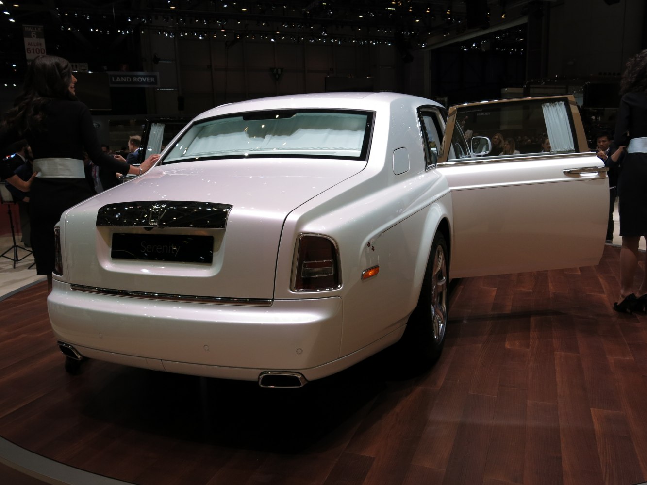 Rear view of luxury extended wheelbase sedan with rear-hinged door open