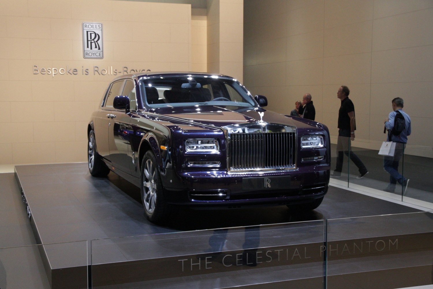 Front view of luxury sedan with iconic large grille and classic Rolls-Royce design